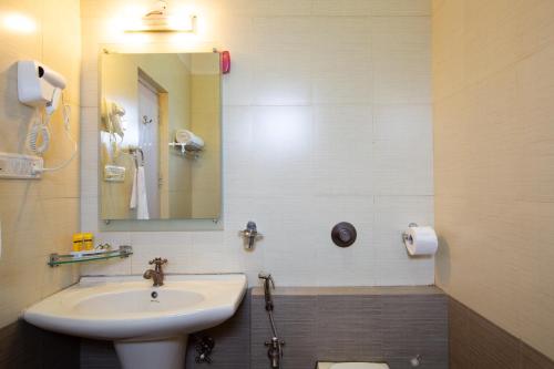 Ένα μπάνιο στο KSTDC Hotel Mayura Valley View Madikeri