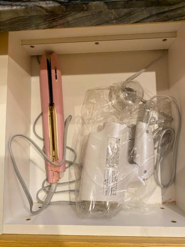 a drawer with a knife and other items in it at Hotel Venus Garden(Adult Only) in Nagoya