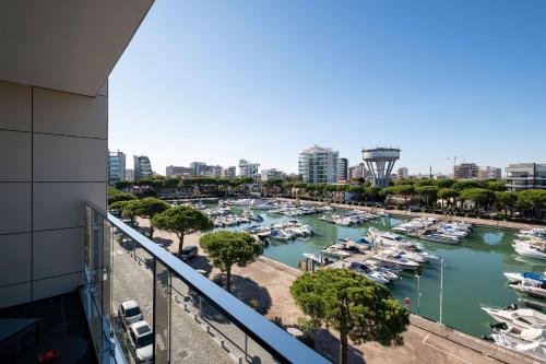 a view of a marina with boats in the water at Hotel Mare in Lignano Sabbiadoro