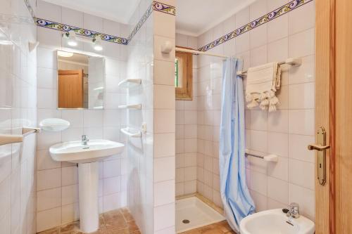 a bathroom with a sink and a shower and a toilet at Possessio Sa Barrala Casa del Pages in Campos
