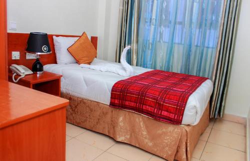 Cama ou camas em um quarto em Sheratton Regency Hotel Nairobi