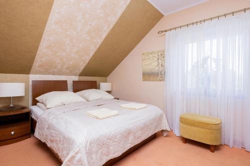 Postel nebo postele na pokoji v ubytování Willa Studio