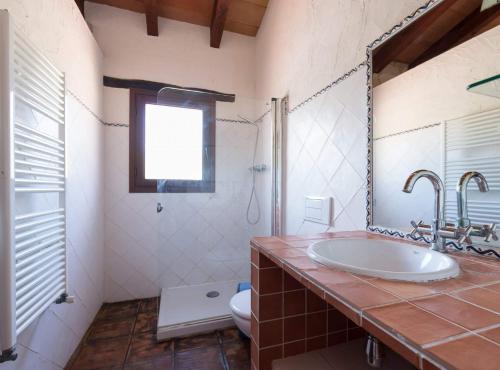 a bathroom with a sink and a toilet at Villa Vinyent - Plusholidays in Calpe