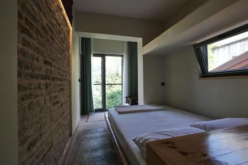 Postel nebo postele na pokoji v ubytování FLANEUR HOSTEL