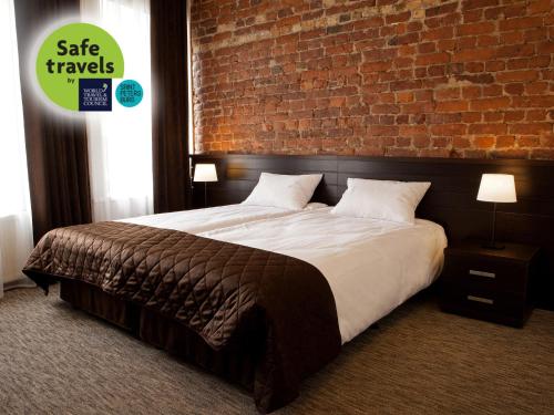 Ein Bett oder Betten in einem Zimmer der Unterkunft Hotel Alfavit