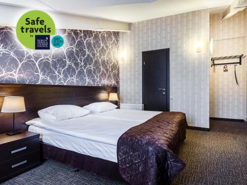 Łóżko lub łóżka w pokoju w obiekcie Hotel Alfavit