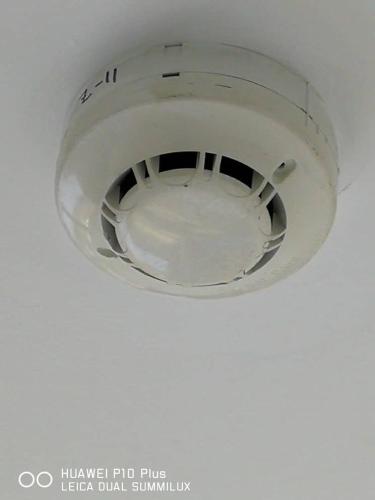 a white light hanging from a ceiling at Grand Bagan Hotel in Butterworth