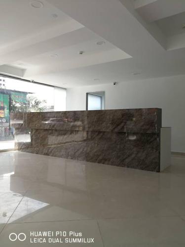 a large stone wall in a large room at Grand Bagan Hotel in Butterworth
