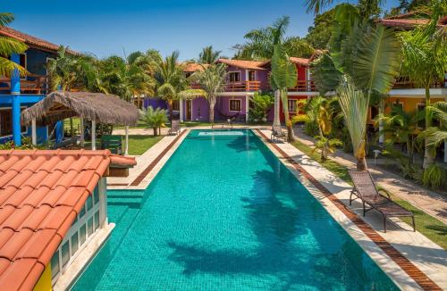 an image of a swimming pool at a villa at Capoeira Village in Porto Seguro