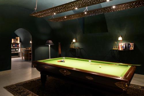 a billiard room with a pool table in it at Relais Rossar Boutique Hotel Garda & Hills in Costermano sul Garda