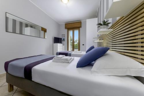 Łóżko lub łóżka w pokoju w obiekcie Casa da Suite Ambiziosa
