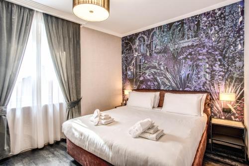 Postel nebo postele na pokoji v ubytování PAX hotel