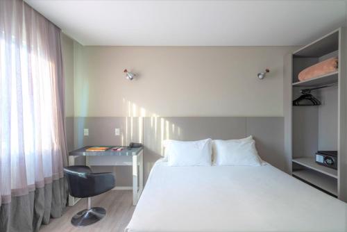 Katil atau katil-katil dalam bilik di Hotel Melo