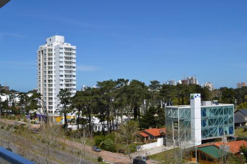 a view of a city with a tall building at Yoo Location in Punta del Este