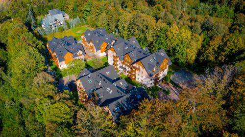 an aerial view of a large house in the forest at Leśny Dom, Sun & Snow in Karpacz