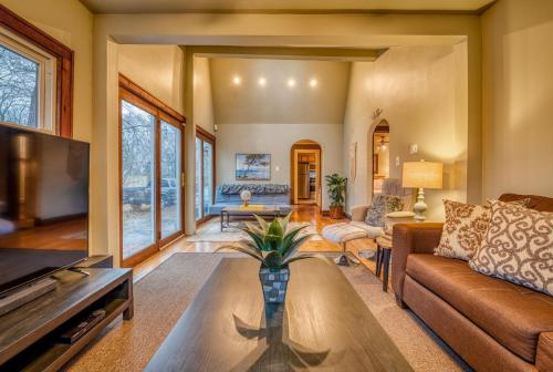 a living room with a couch and a table at Secluded Fenced Cottage W Dune Top Hot Tub Near Hiking Dog Friendly in Miller
