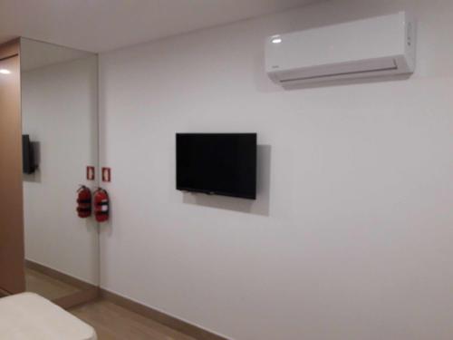 A television and/or entertainment center at Central Suites 2 Quarto A