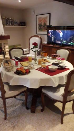 a table with a plate of food on it at La Merlette89 in Lailly