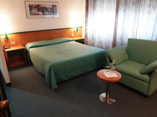 Postel nebo postele na pokoji v ubytování Hotel Ramoverde