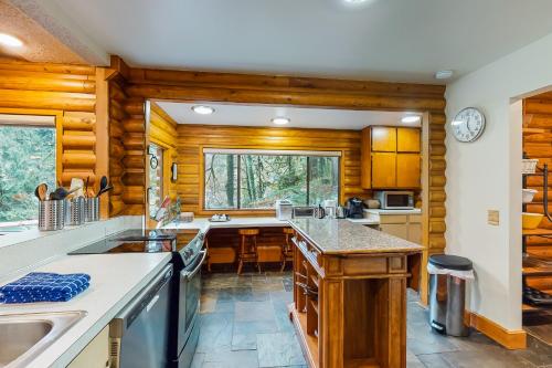 a kitchen with wooden walls and wooden counters at River Bend Lodge in Washougal
