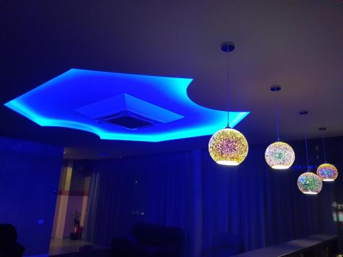 a blue light on a ceiling in a room at LEX Trend Hotel in Irpin'