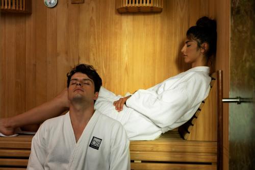 a man and a woman in a sauna at bs Rosales Hotel in Bogotá
