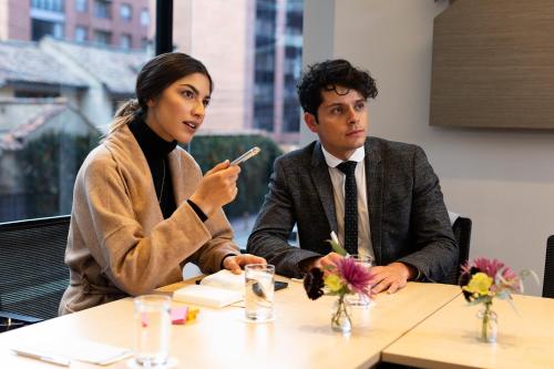 a man and a woman sitting at a table at bs Rosales Hotel in Bogotá