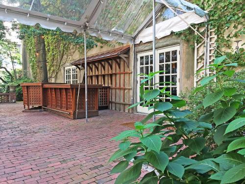 a building with a porch with a brick patio at Morris House Hotel in Philadelphia