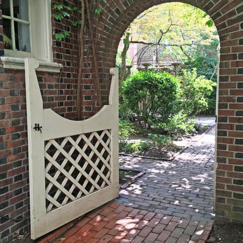 an entrance to a brick building with an open gate at Morris House Hotel in Philadelphia