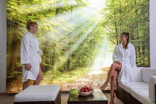 two women in the forest wallpaper at Kohlers Hotel Engel in Bühl
