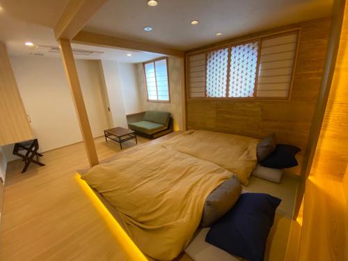Ένα ή περισσότερα κρεβάτια σε δωμάτιο στο 日月庵 BnB Sunmoon