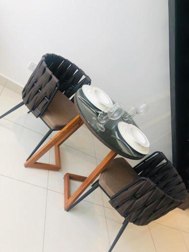 a pair of shoes sitting on top of a chair at Embassy Gardens Luxury Apartments in Accra