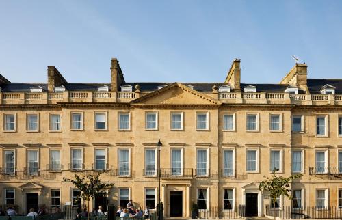 a large building with a clock on the front of it at Hotel Indigo - Bath, an IHG Hotel in Bath