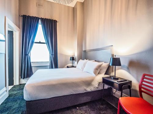 Postel nebo postele na pokoji v ubytování Telegraph Hotel Numurkah