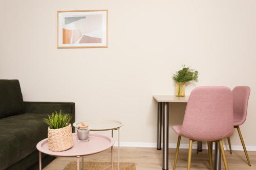 a living room with a couch and two chairs and a table at Urban Residence Apartments in Mostar