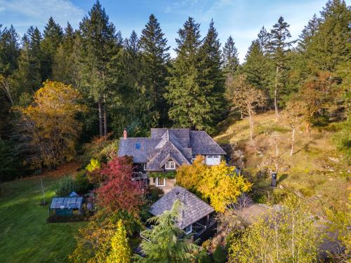 an aerial view of a house on a hill with trees at Amante Luxury Bed & Breakfast in Victoria