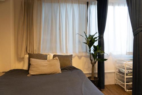 Llit o llits en una habitació de Higashi Shinagawa Apartment