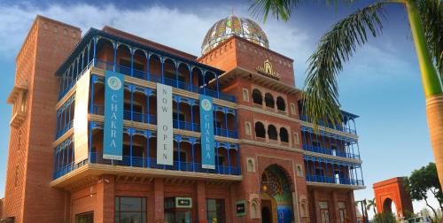 a building with a clock tower on top of it at Namaste Dwaar - The Gateway to Rural India in Khatauli