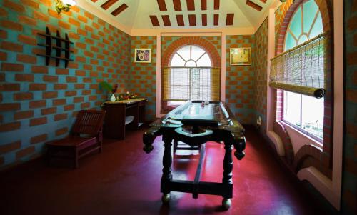a room with a table in the middle of a room at Namaste Dwaar - The Gateway to Rural India in Khatauli