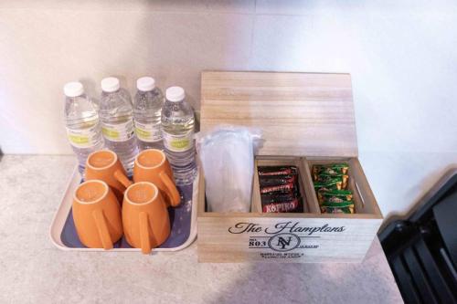 a box with bottles of water on a counter at Spacious 3 Bedrooms by Cozy Home in Bayan Lepas