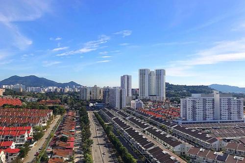an aerial view of a city with tall buildings at Spacious 3 Bedrooms by Cozy Home in Bayan Lepas