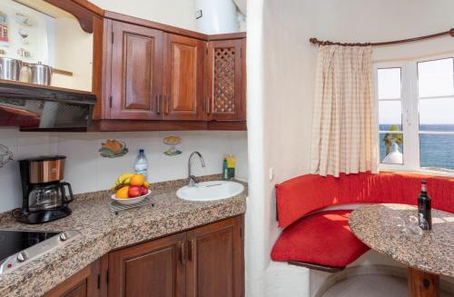 a small kitchen with a sink and a window at Altamar 53 balcony sea views By CanariasGetaway in Playa del Aguila