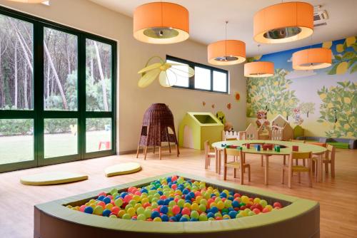 a room with a large ball pit in the middle at Falkensteiner Club Funimation Garden Calabria in Curinga