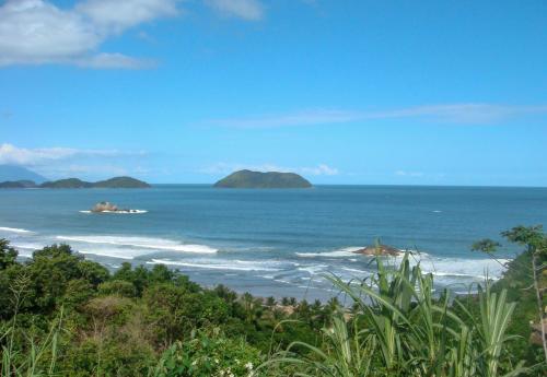 a view of the ocean with islands in the distance at Pousada Etoile in Juquei