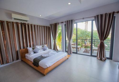 Katil atau katil-katil dalam bilik di Saline Residence