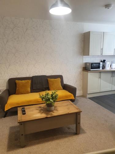 a living room with a couch and a coffee table at St Leonards cottage in Newark upon Trent