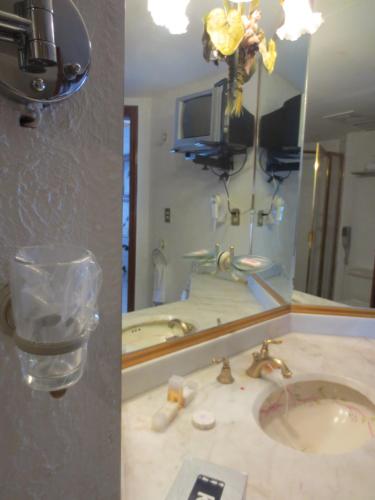 a bathroom with a sink and a mirror at Gran Hotel Hacienda De La Noria in Aguascalientes