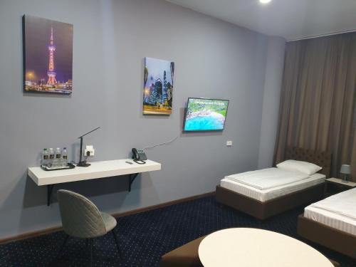 a hotel room with a bed and a sink at LEX Trend Hotel in Irpin'