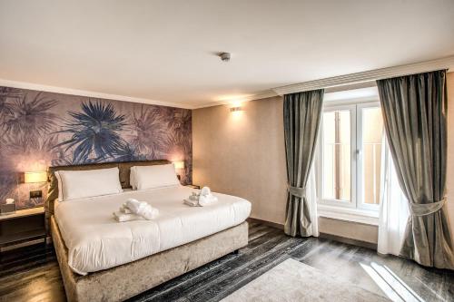 Postel nebo postele na pokoji v ubytování PAX hotel