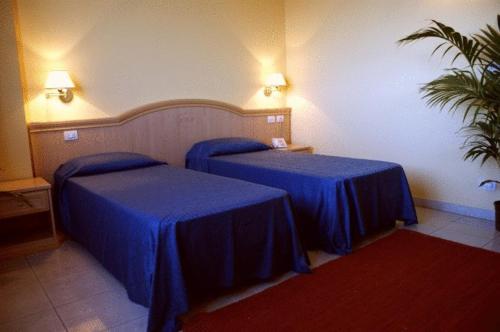 Postel nebo postele na pokoji v ubytování Yacht Marina Hotel